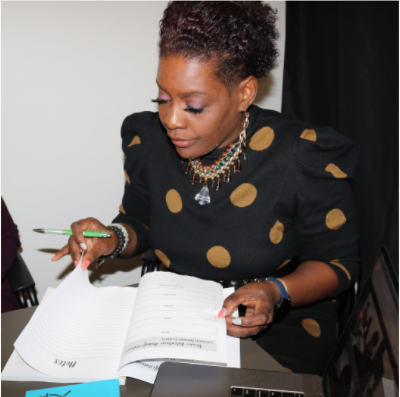 Dr Alisha Griffith signing Mompreneurs Life-Biz Planner